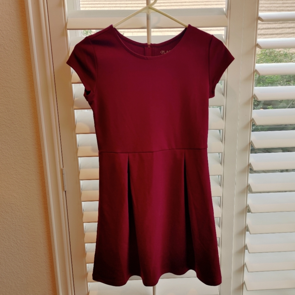 Brand new Girl's Dressy dress. Wine/rust color